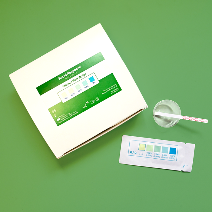 Alcohol Test Strip box, pouch, and test strip in a plastic collection cup