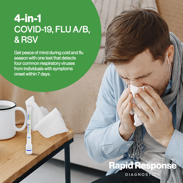 Man blowing out nose at home with Rapid Response 4-in-1 COVID-19, FLU A/B & RSV Test
